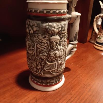 A VARIETY OF STEINS AND BEER MUGS