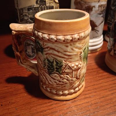 A VARIETY OF STEINS AND BEER MUGS