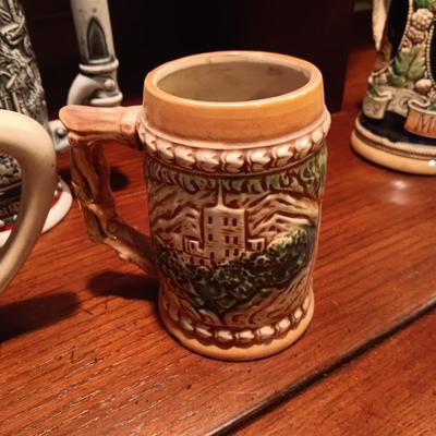 A VARIETY OF STEINS AND BEER MUGS