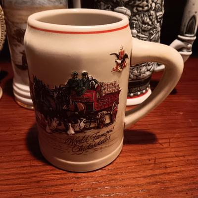 A VARIETY OF STEINS AND BEER MUGS