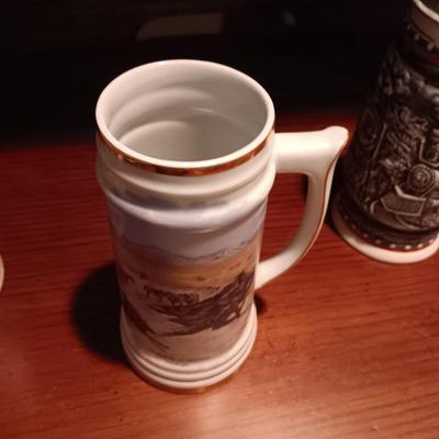 A VARIETY OF STEINS AND BEER MUGS