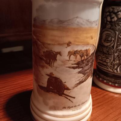 A VARIETY OF STEINS AND BEER MUGS