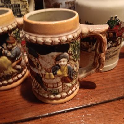 A VARIETY OF STEINS AND BEER MUGS