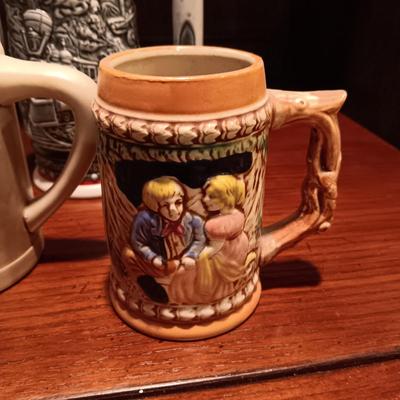 A VARIETY OF STEINS AND BEER MUGS