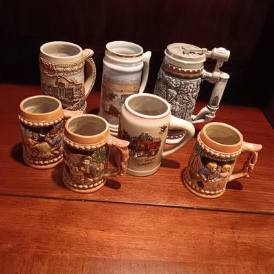 A VARIETY OF STEINS AND BEER MUGS