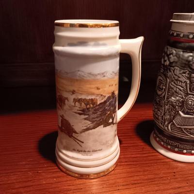 A VARIETY OF STEINS AND BEER MUGS