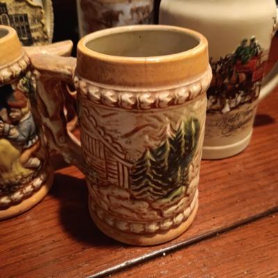 A VARIETY OF STEINS AND BEER MUGS
