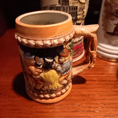 A VARIETY OF STEINS AND BEER MUGS