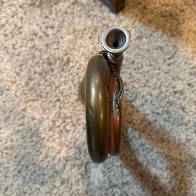 VINTAGE COPPER AND BRASS BUGLE AND A COILED CANDLE BY THE HOUR