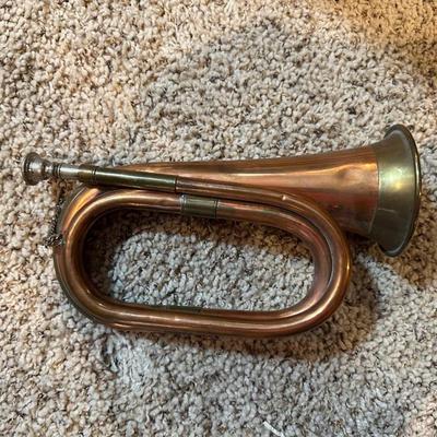 VINTAGE COPPER AND BRASS BUGLE AND A COILED CANDLE BY THE HOUR