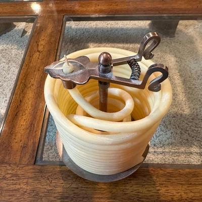 VINTAGE COPPER AND BRASS BUGLE AND A COILED CANDLE BY THE HOUR