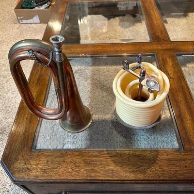 VINTAGE COPPER AND BRASS BUGLE AND A COILED CANDLE BY THE HOUR