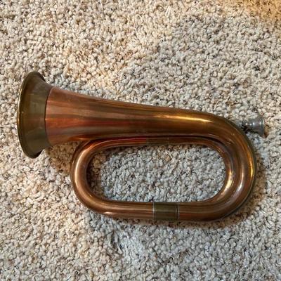 VINTAGE COPPER AND BRASS BUGLE AND A COILED CANDLE BY THE HOUR