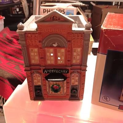 CHRISTMAS VILLAGE BUILDINGS AND CANDLES