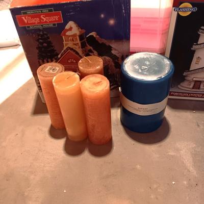 CHRISTMAS VILLAGE BUILDINGS AND CANDLES