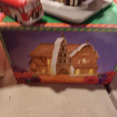 CHRISTMAS VILLAGE BUILDINGS AND CANDLES