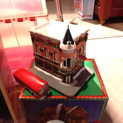 CHRISTMAS VILLAGE BUILDINGS AND CANDLES
