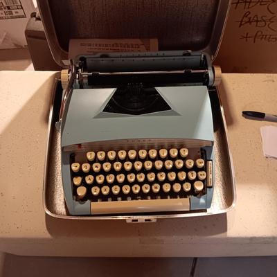 BABY BLUE TOWER MANUAL TYPEWRITER IN A CASE