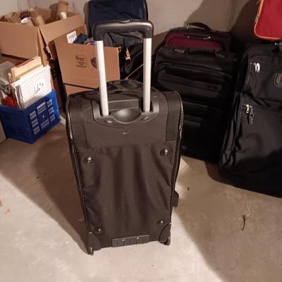 SAMSONITE 4 WHEEL SUITCASE AND A NRA DUFFLE BAG ON 2 WHEELS WITH HANDLE