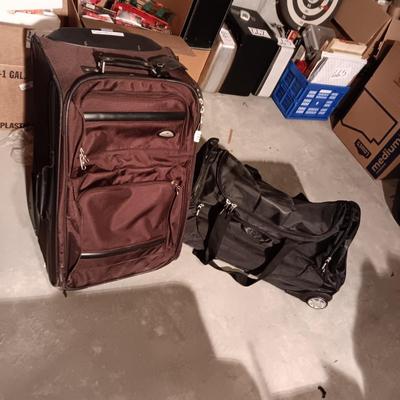SAMSONITE 4 WHEEL SUITCASE AND A NRA DUFFLE BAG ON 2 WHEELS WITH HANDLE