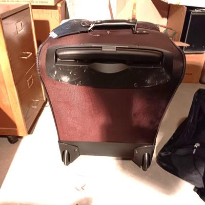 SAMSONITE 4 WHEEL SUITCASE AND A NRA DUFFLE BAG ON 2 WHEELS WITH HANDLE