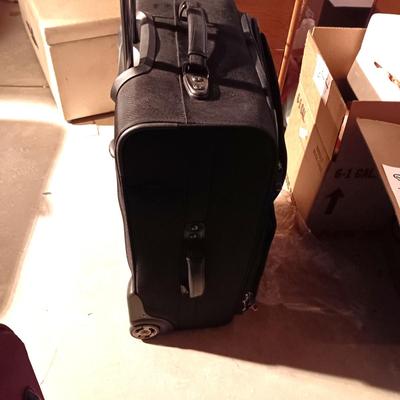 2 SUITCASES ON 2 WHEELS WITH HANDLES