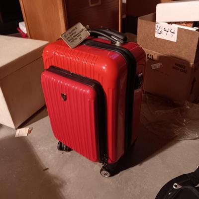 LIKE NEW RED CARRY ON WITH 4 WHEELS AND DUFFLE BAG ON 2 WHEELS