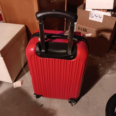 LIKE NEW RED CARRY ON WITH 4 WHEELS AND DUFFLE BAG ON 2 WHEELS