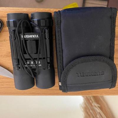 BUSHNELL BINOCULARS AND A GERBER POCKET KNIFE