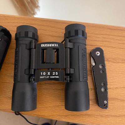 BUSHNELL BINOCULARS AND A GERBER POCKET KNIFE