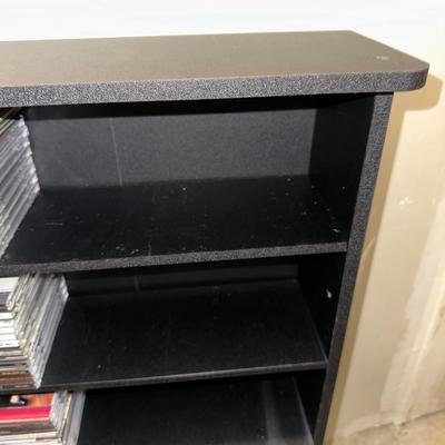 MEDIA RACK WITH AN ASSORTMENT OF DISCS