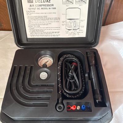 Portable air compressor that plugs into the cigarette lighter in your car