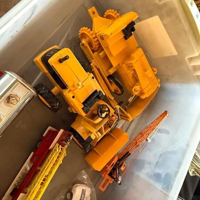 2 boxes of vintage trucks/tractors/toys