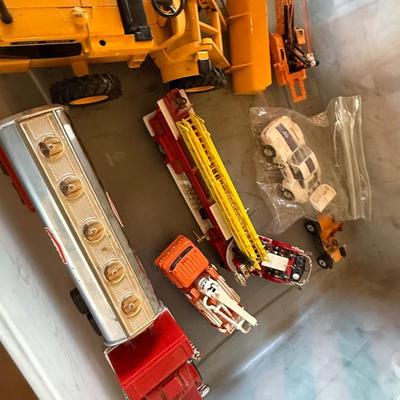 2 boxes of vintage trucks/tractors/toys