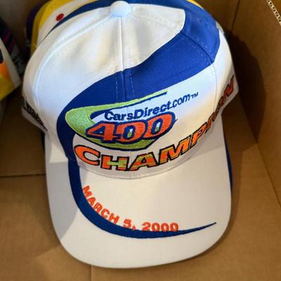 Lot of mostly Nascar themed ball caps/hats