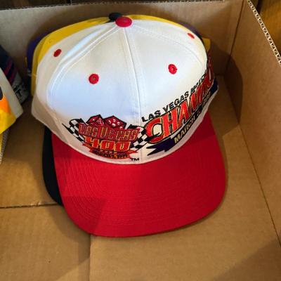 Lot of mostly Nascar themed ball caps/hats