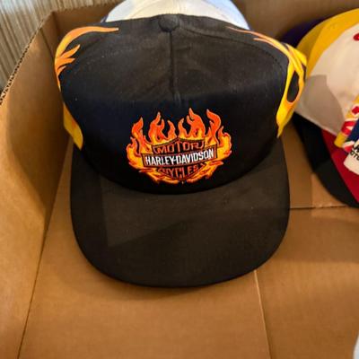 Lot of mostly Nascar themed ball caps/hats