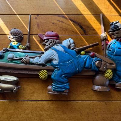 Metal wall decoration of 3 guys playing pool