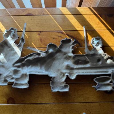 Metal wall decoration of 3 guys playing pool