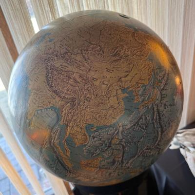 Vintage large spinning globe on black plexiglass stand