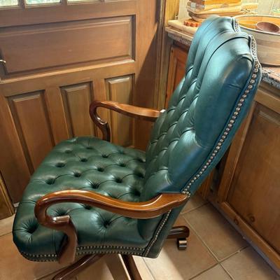 Rolling tufted green leather & wood Arm Chair w/brass tacks