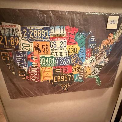 Wood art piece showing state license plates in US shape- New