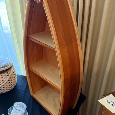 Canoe motif wood with brass accent 35”t x 16”w wall shelf