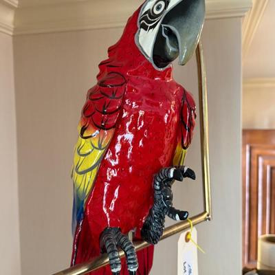 Colorful Red Parrot on brass bird stand/pirch