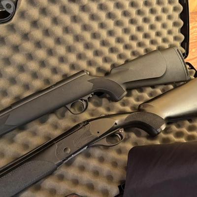 Pair of Replica black rifles and padded carrying case