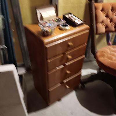 ANTIQUE CHAIR ON CASTERS AND A SMALL 4 DRAWER CHEST PACKED WITH SEWING NOTIONS AND CRAFT SUPPLIES