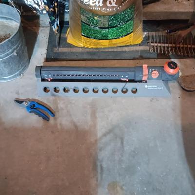 UNOPENED BAG OF FERTILIZER, YARD TOOLS, WINDSHIELD SUN SHADE AND MORE
