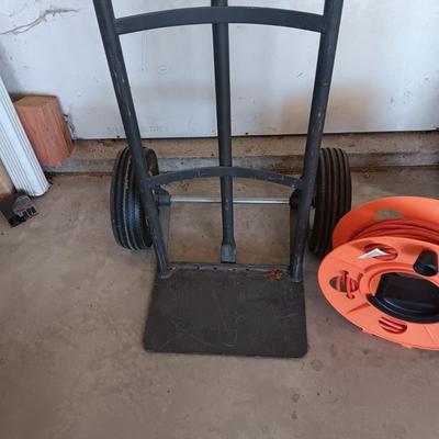 FURNITURE DOLLY AND EXTENSION CORD ON A REEL
