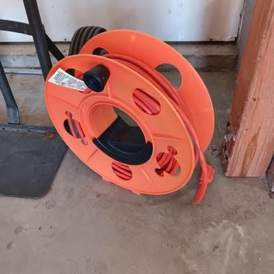 FURNITURE DOLLY AND EXTENSION CORD ON A REEL