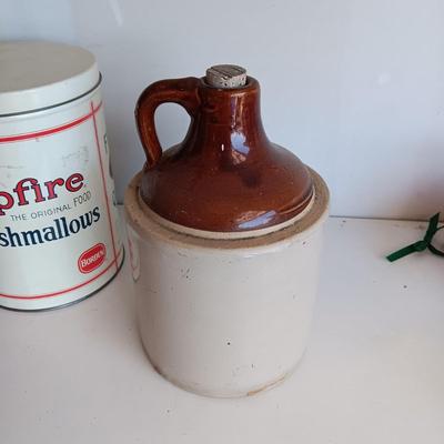 CLAY JUG, INTERNATIONAL HARVESTER MATCH HOLDER AND AN OLD TIN